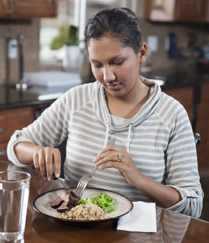 Woman eating healthy food.